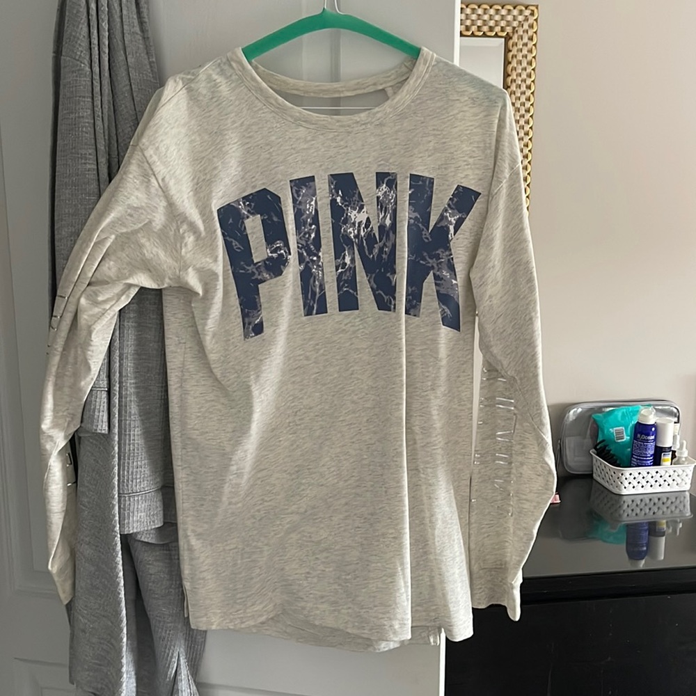 Pink sweatshirt worn only couple times. There is an open back